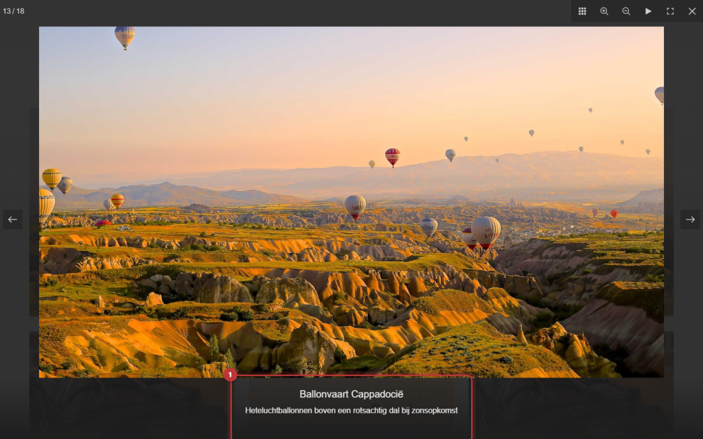 Een vergrote foto in de lightbox van de galerij met daaronder de titel Ballonvaart Cappadocië en de alt-tekst, de tekst onder de foto is gemarkeerd