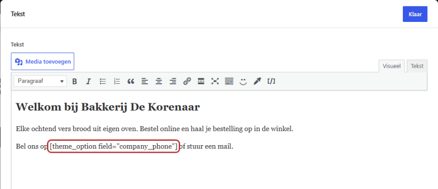 Het tekstveld van het blok Tekst met de zin Bel ons op en daarachter de shortcode voor het telefoonnummer, die gemarkeerd is