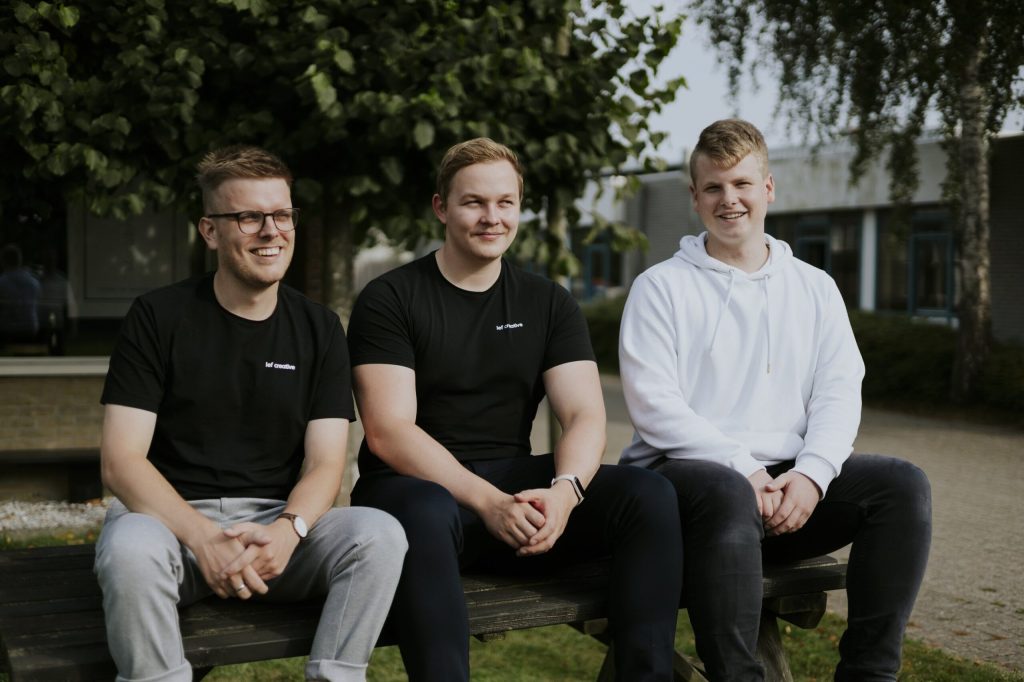 The Lef Creative team on a bench outside the office